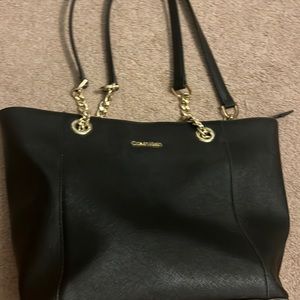 Black Calvin Klein purse with gold accents